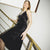 Bushra Vegan Silk Black Cupro Midi Dress On The Stairs