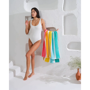 Add some fun to your beach day with this multicolor striped towel.