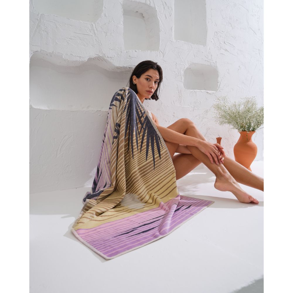 womenRelax in style on the beach with our super-soft Breath organic cotton towel for women.